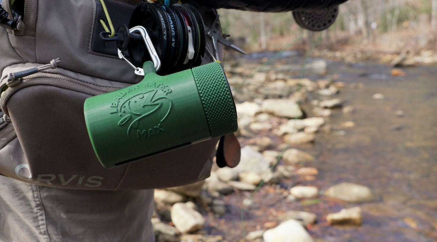Leader Eater Max clipped to waders on a clear mountain stream, ready for a day of conservation fishing