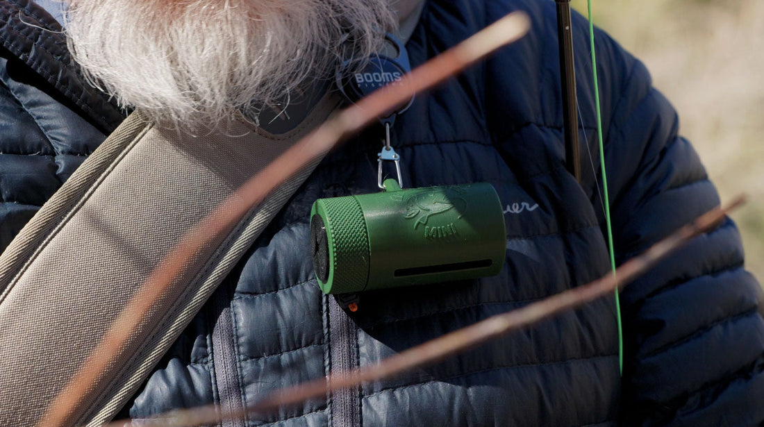 Angler feeding leader line into the Leader Eater Mini while fly fishing
